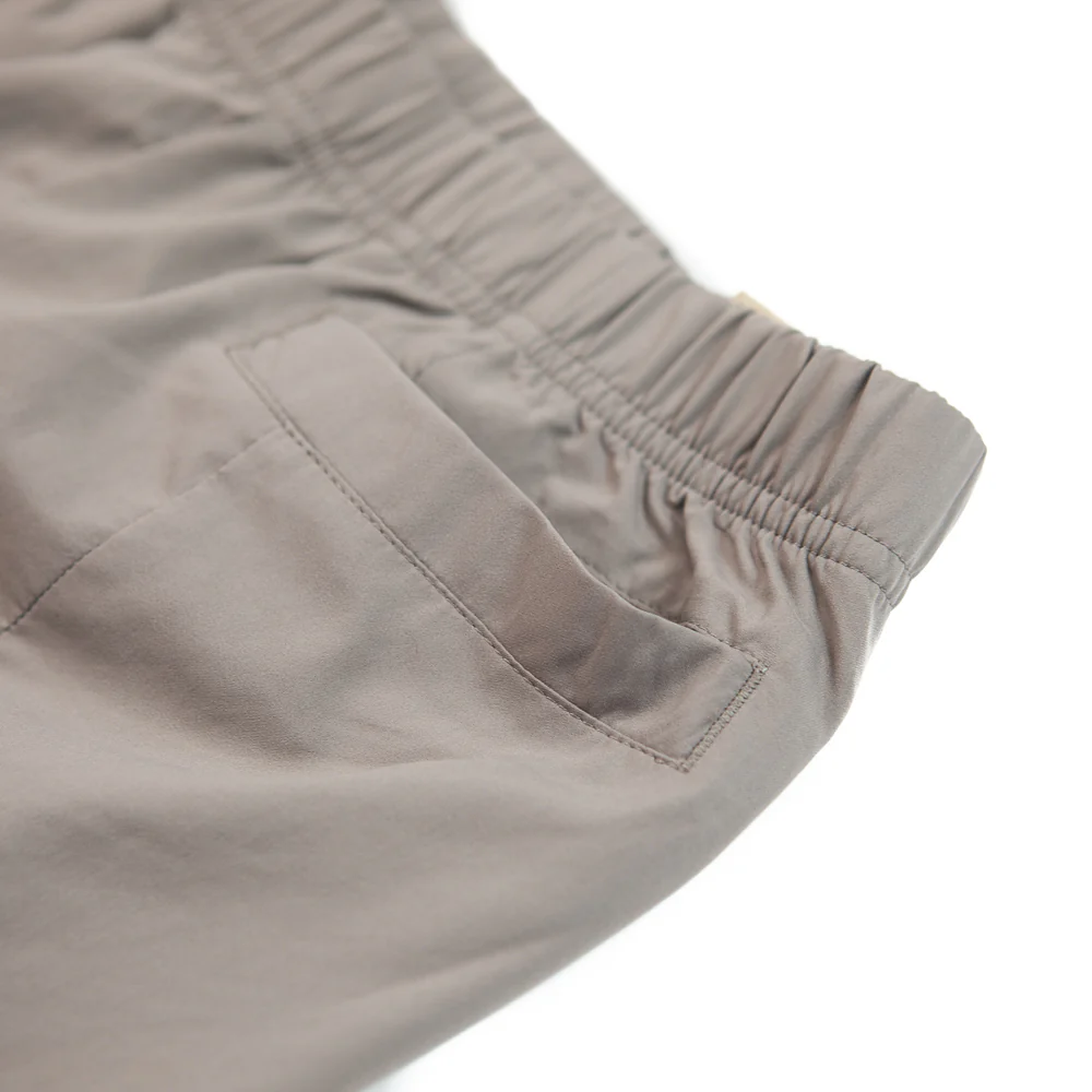 WMNS NSW Dri-FIT Tech Pack High-Rise Woven Trousers (Moon Fossil/Cave Stone) - Image 2